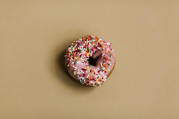 sprinkle donut on gold background