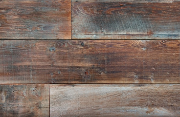 Section of three boards of reclaimed lumber.