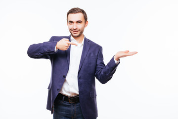 Happy smiling man on shirt presenting and showing something on white background