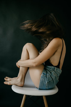 Young Woman With Face Covered