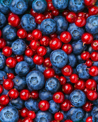 Background of different berries and fruits.