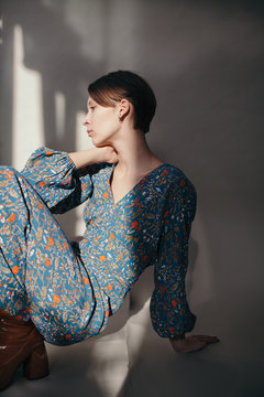 Fashion portrait of female wearing flower dress
