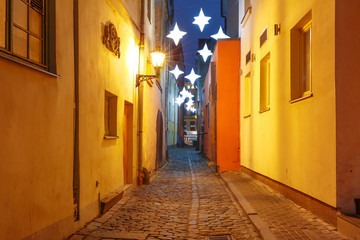 Fototapeta premium Decorated and illuminated Christmas street of Old Town at night, Riga, Latvia