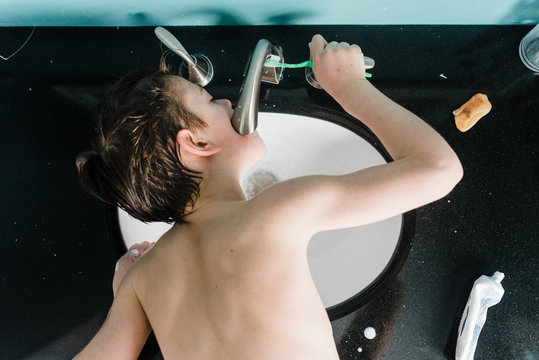 boy brushing his teeth