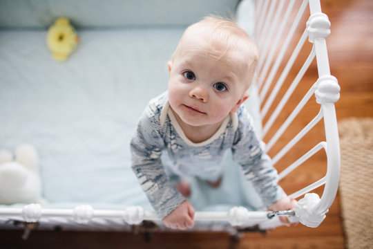 Baby Standing In His Crib