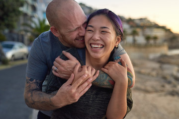 Multi-racial couple laughing having fun