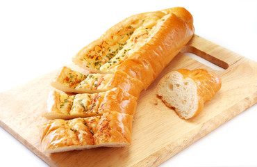 Garlic bread on wooden board     