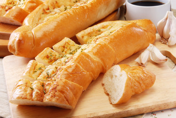 Garlic bread on wooden board     