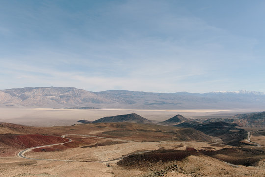 Curving road through desert landscape in Death Valley, California