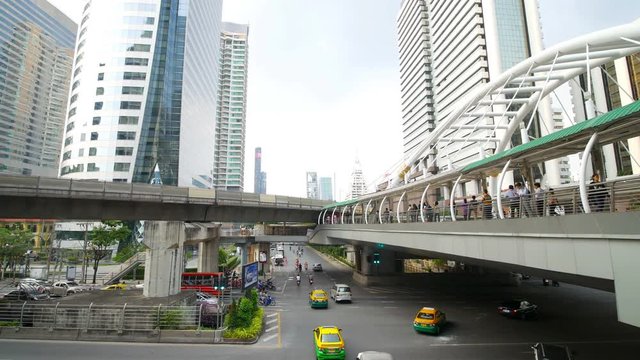 BANGKOK, THAILAND November 18, 2017: 4k video of public sky walk and traffic at Chong Nonsi sky train station, Bangkok, Thailand