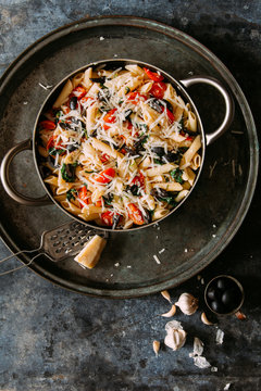 Sauteed cherry tomatoes and spinach pasta