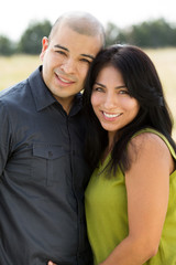 Young Hispanic couple smiling.