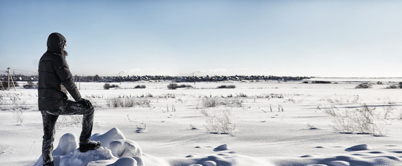 silhouette people stand in winter field in sunny day