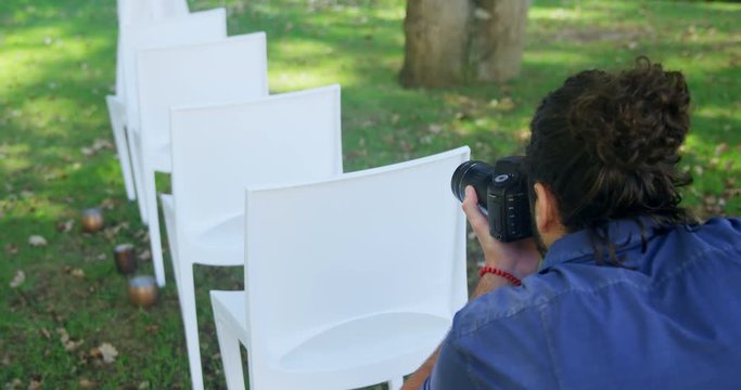 Photographer taking photo of chairs  