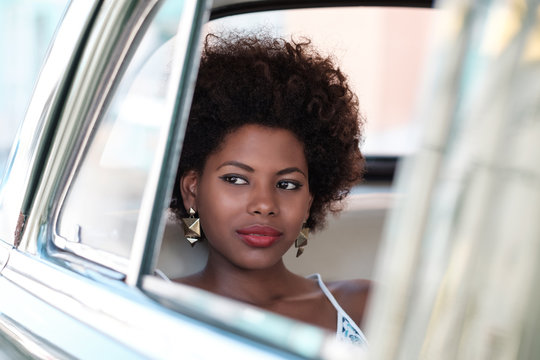 Beautiful African Woman Sitting Inside The Car