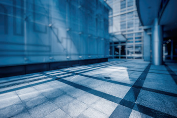 empty brick road nearby office building, china