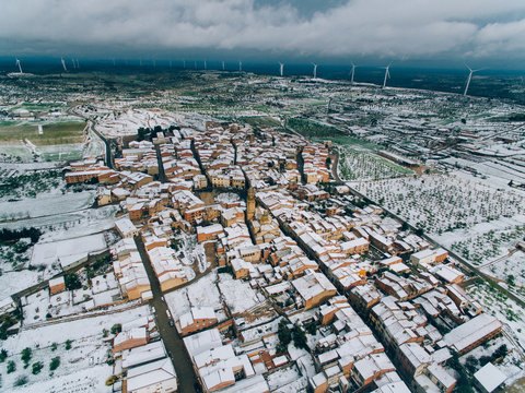 Aerial view of village with snow