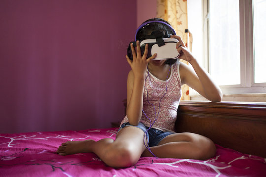 Teenage girl wearing virtual reality headset