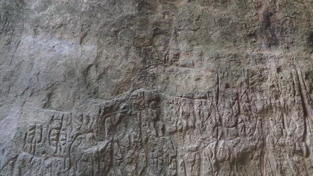 Gobustan is the national reserve of Azerbaijan. Petroglyphs of the ancient inhabitants of the planet. Ancient rock carvings, wild mountain landscapes, mountains and tourists.