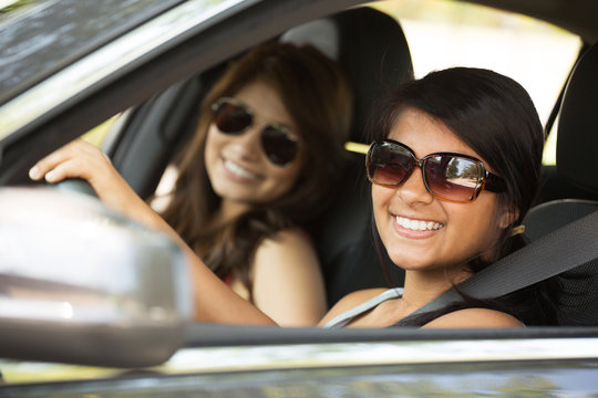 Friends driving taking a road trip.