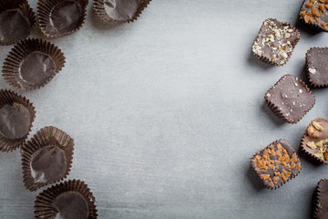 Several chocolate treats next to many empty wrappers.