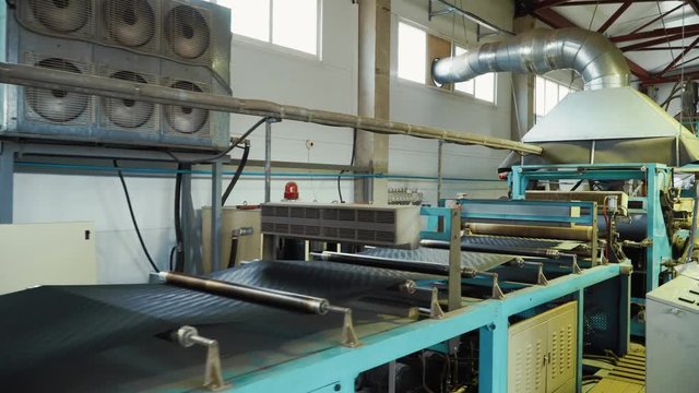 The production of the geogrid in the machine in the plant.