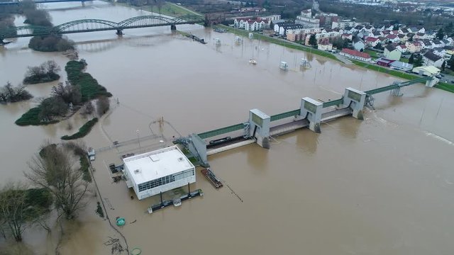 Flooded river banks and water lock at Main River, Germany after heavy rainfall - aerial view