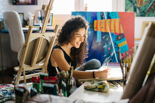 Cheerful artist creating
