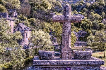 Cross on bridge over the river Aveyron France