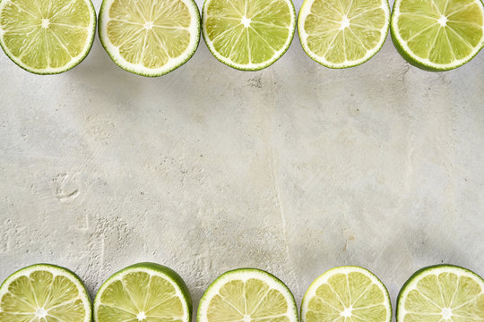 Row of fresh sliced limes with copy space
