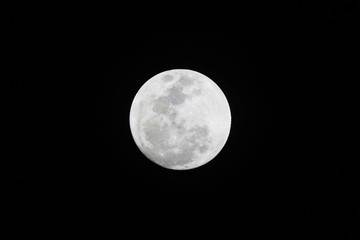 Full moon isolated on dark sky background