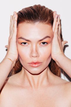 Beauty shoot, expressive ginger woman with great skin over white background