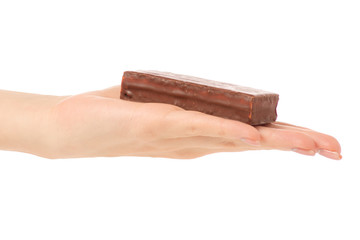 Chocolate cake candy biscuit milk in hand