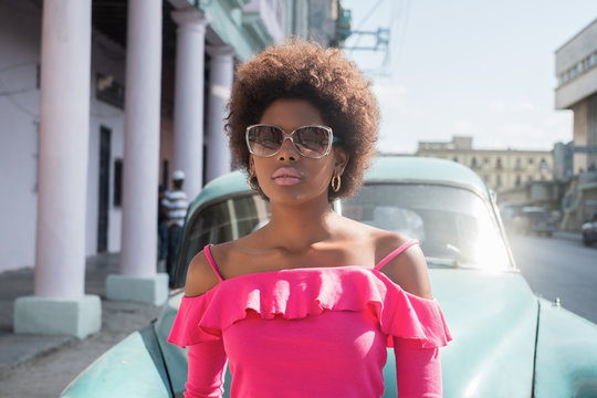 Beautiful Cuban Girl In front Of The Old Timer Car