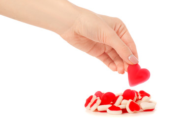 Jelly heart candies sweets in hand