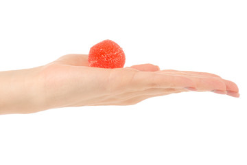 Fruit jelly in sugar in hand