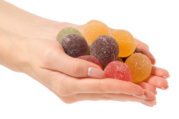 Fruit jelly in sugar in hand