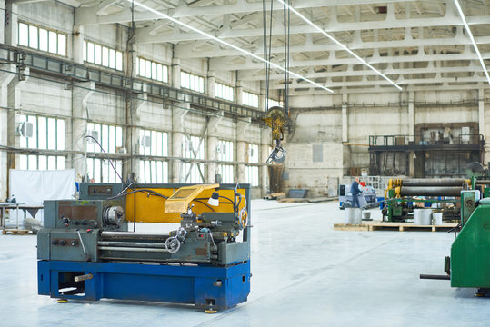 Wide angle shot of  spacious light workshop at modern factory,  industrial background with copy space