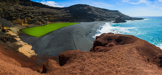 Large panorama of Volcanic green lake (El Lago Verde, Charco de los Clicos) in El Golfo. Lanzarote....