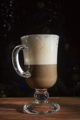 Coffee with milk in a transparent cup