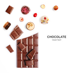 Creative layout made of chocolate bar and chocolate praline. Flat lay. Food concept. Macro  concept.