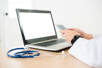 closeup photo of doctor using mobile smartphone
