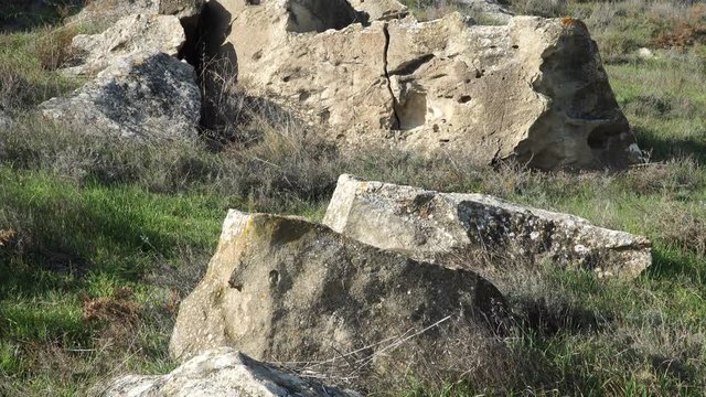 Gobustan is the national reserve of Azerbaijan. Petroglyphs of the ancient inhabitants of the planet. Ancient rock carvings, wild mountain landscapes, mountains and tourists.