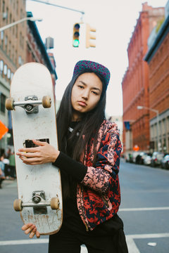 Young woman with skateboard