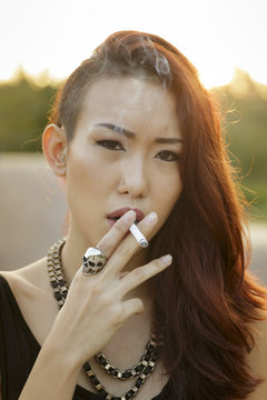Edgy asian girl smoking