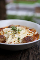 Pasta meatballs tomato sauce on wood background