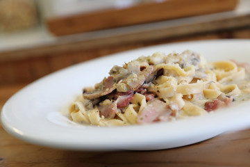 pasta fettuccine alfredo white sauce with ham bacon and mushroom