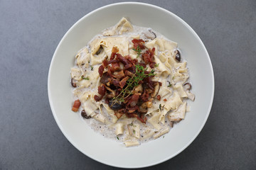 pasta fettuccine alfredo white sauce with ham bacon and mushroom