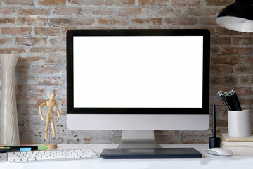 Creative desktop with blank white computer monitor, Workplace with modern desktop pc comfortable work table. Designer loft desk space concept.