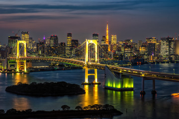 Beautiful night view of Tokyo Bay, Rainbow bridge and Tokyo Tower landmark Twilight scene, Odaiba, Japan